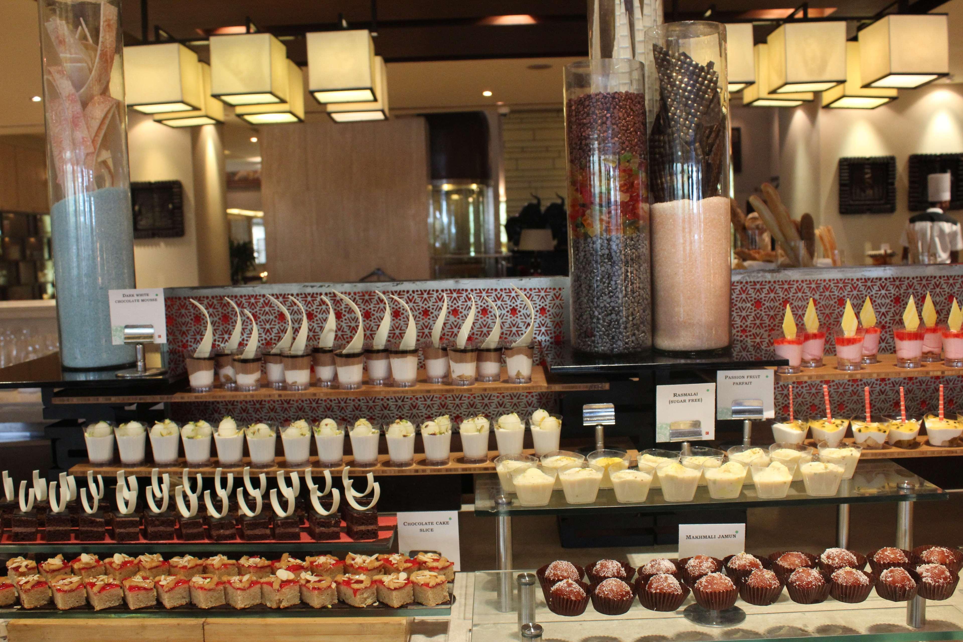 The Lalit New Delhi Hotel Exterior photo A dessert buffet
