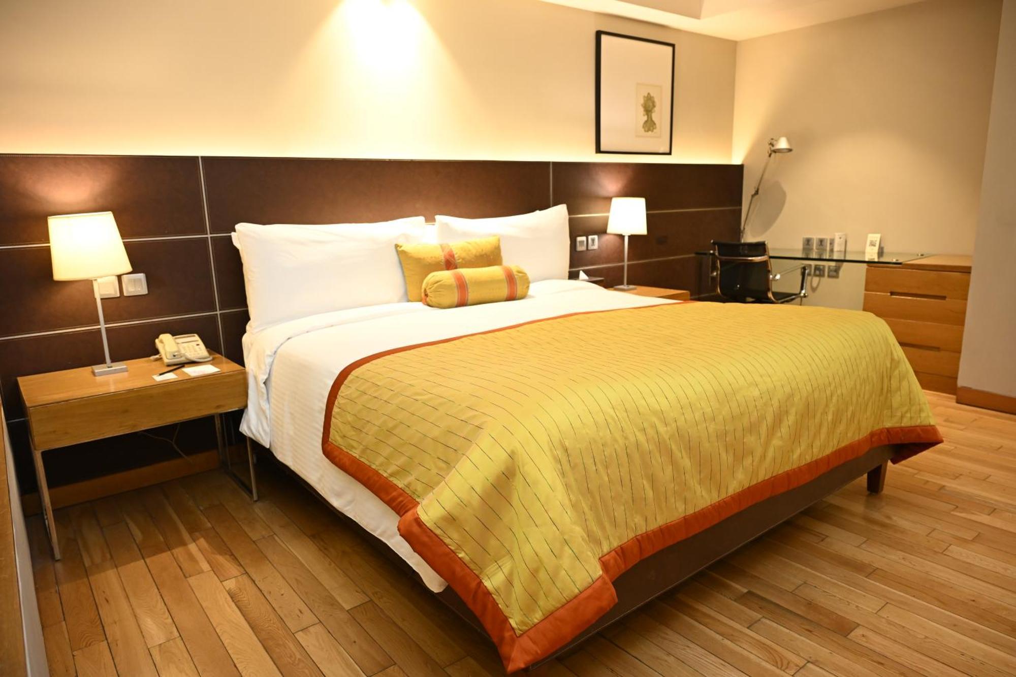 The Lalit New Delhi Hotel Exterior photo A bedroom at the Taj Mahal Palace, Mumbai
